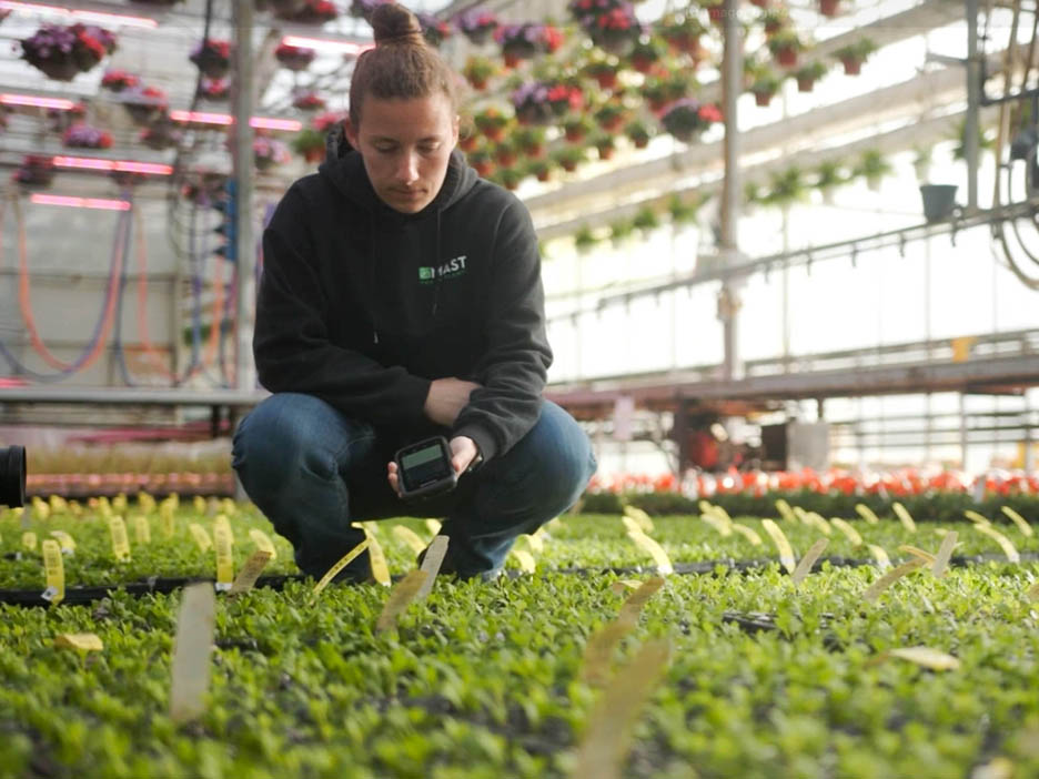 Grower scanning label on plant